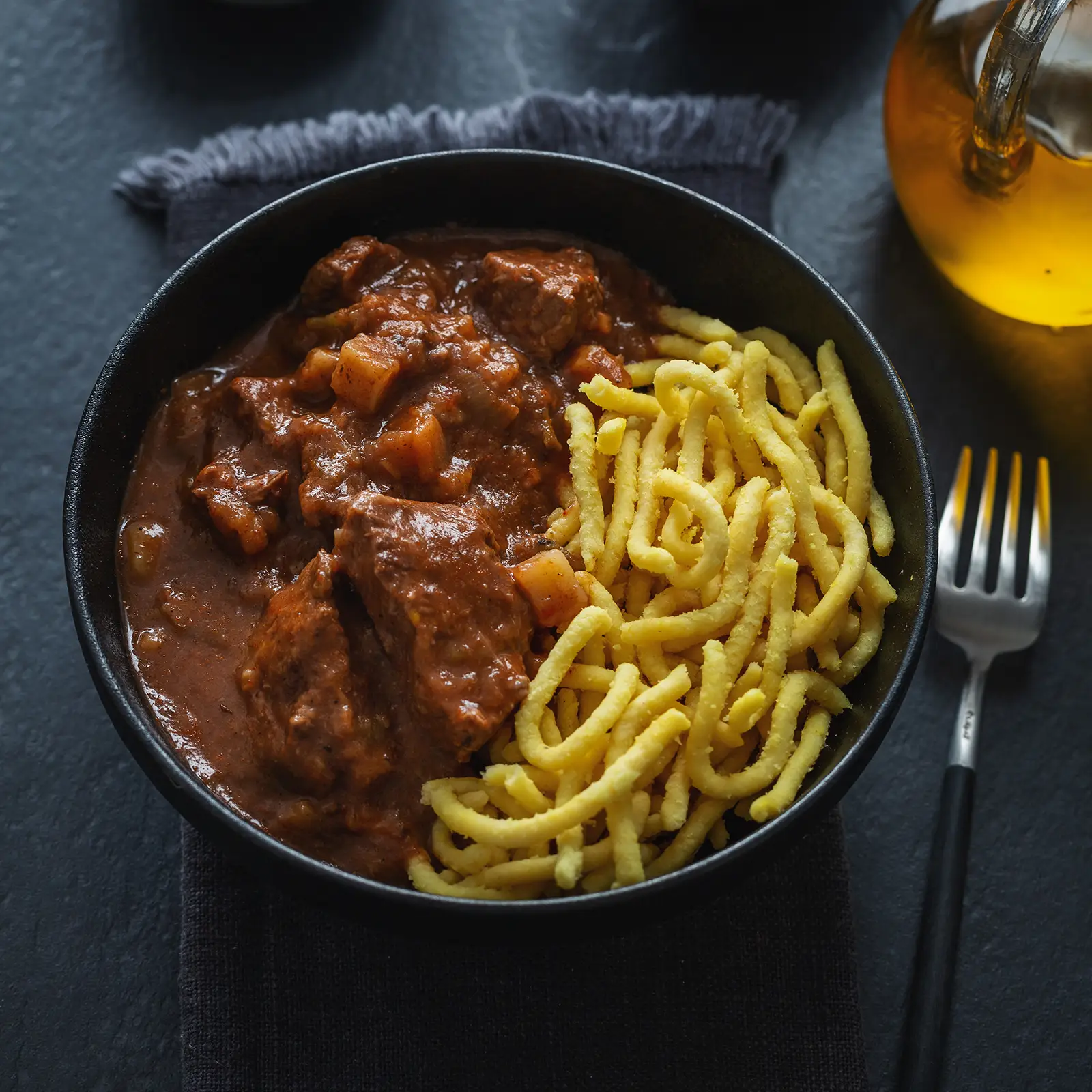 meat-ragout-stew-with-noodles-in-bowl